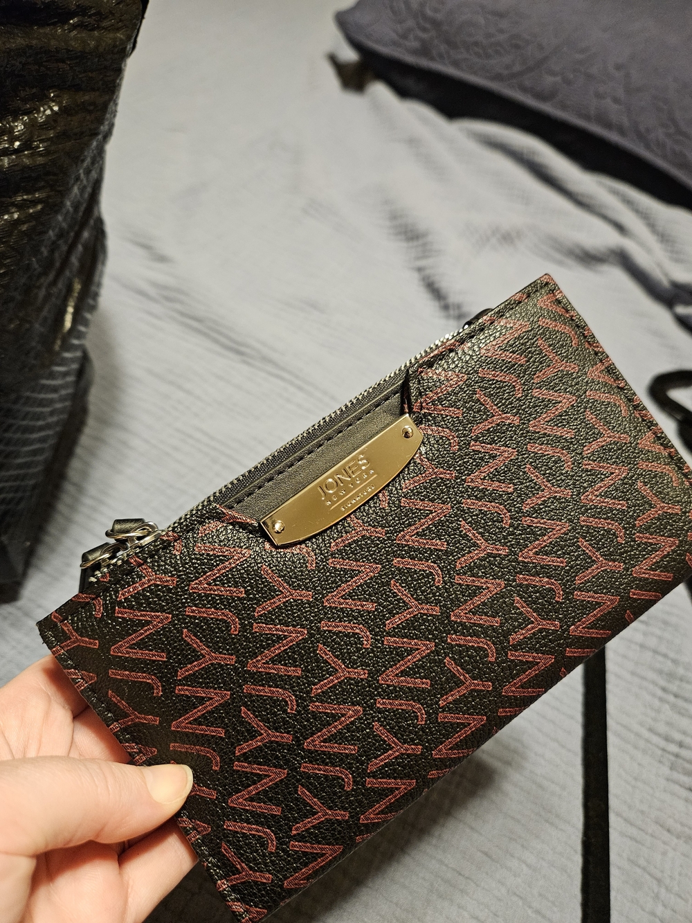 Jones New York Black Wristlet with Pink Logo Print and Gold Plate